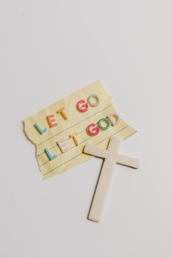 A note with the phrase 'Let Go, Let God' alongside a cross on a white background. Trust God how to homeschool